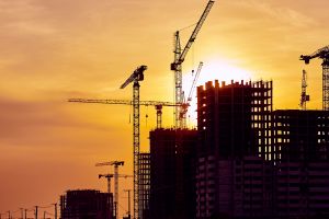 Construction site at dusk evening yellow back light, crane