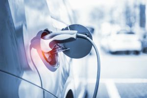 Electric Car Charging At Power Station